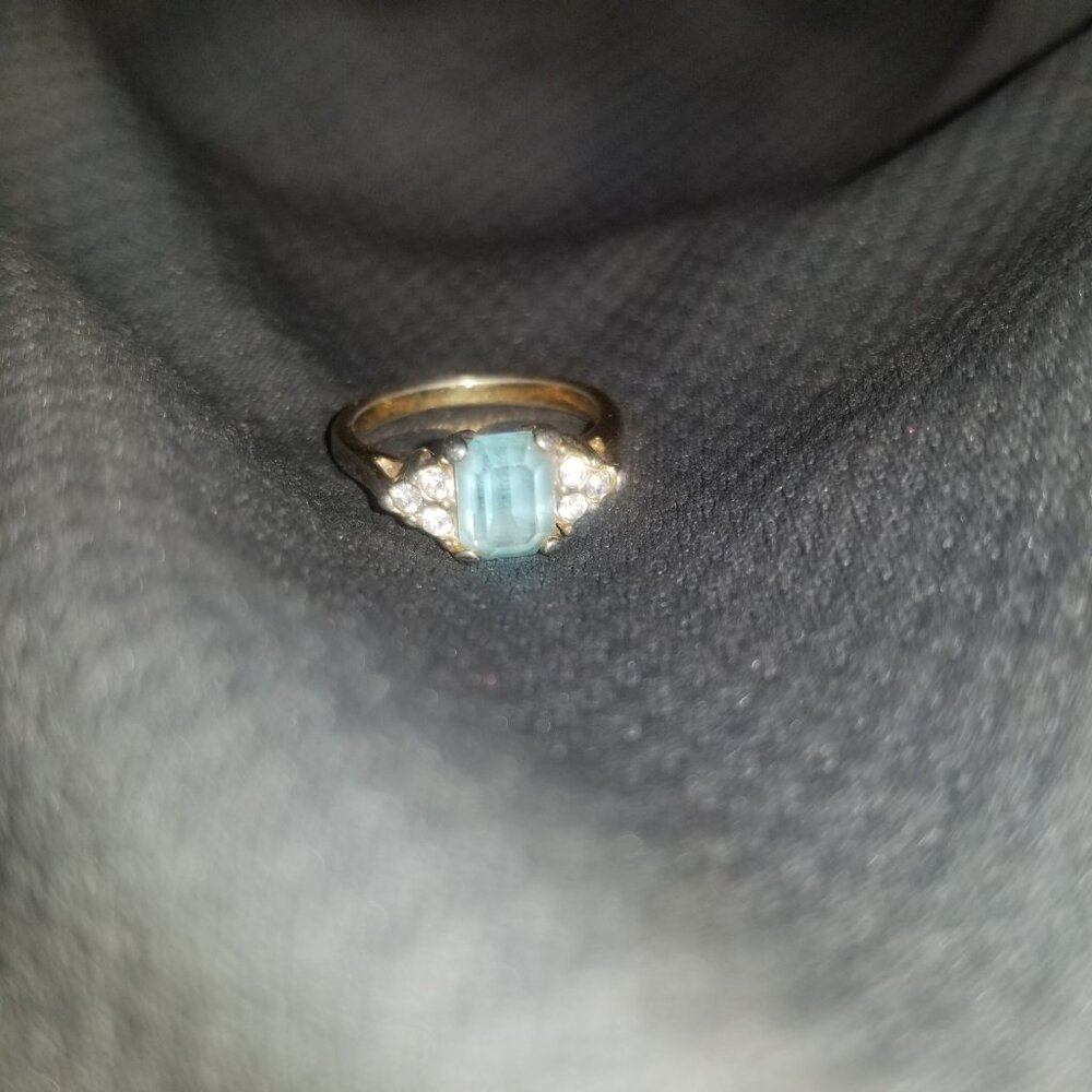 Ladies ring light blue stone and diamond golden ring